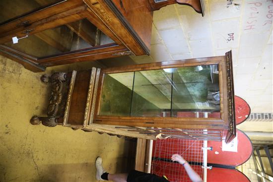 An early 20th century George I style parcel gilt walnut display cabinet, W.148cm, D.44cm, H.148cm